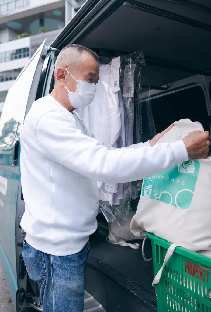 Driver packing items in the van
