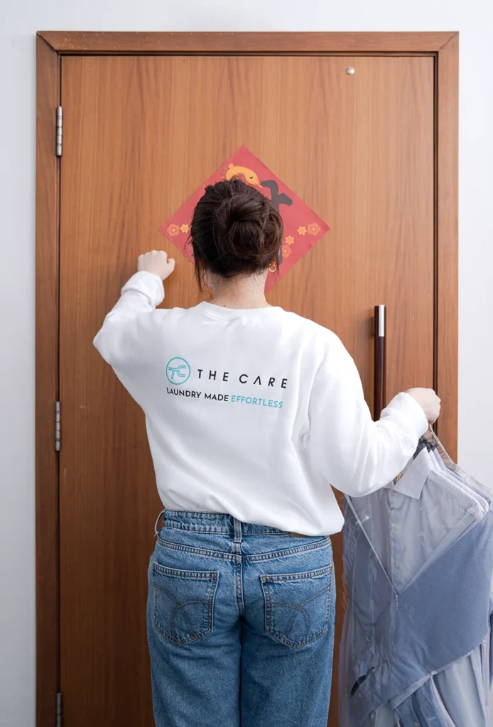Staff knocking customer door | The Care Laundry